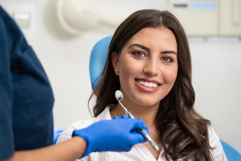 Woman with gorgeous smile at the dentist