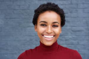A woman smiling after teeth whitening in Oakton, VA